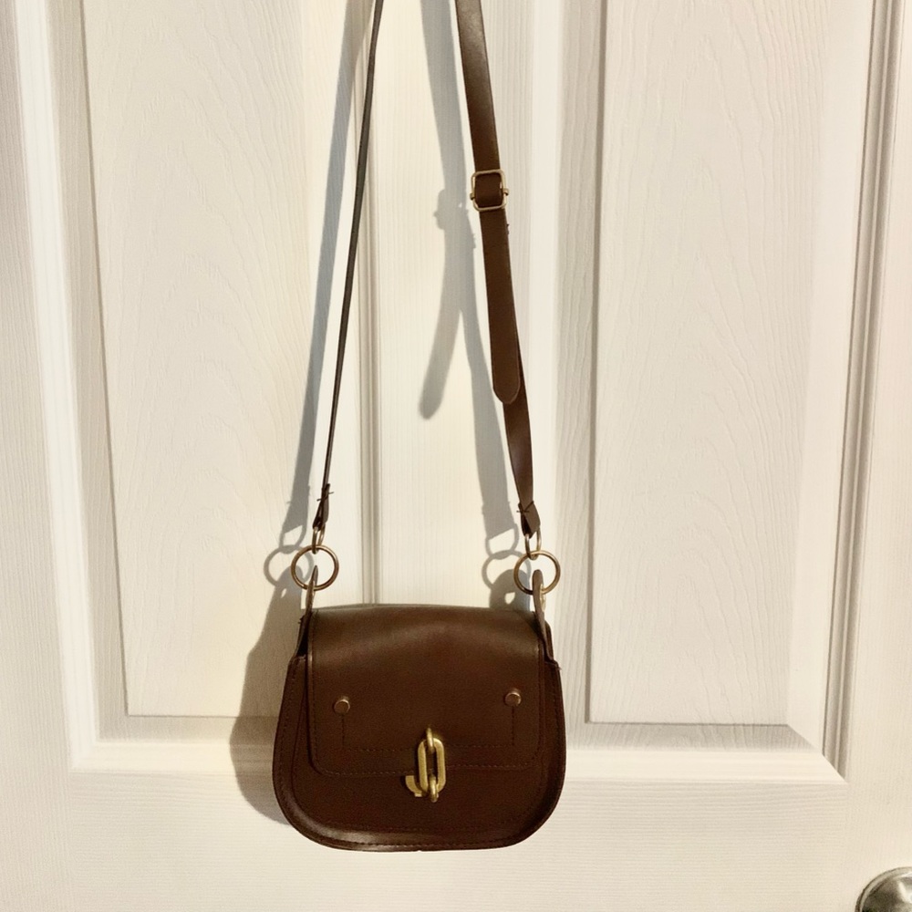Brand new handbag. Brown. Snap closure.
